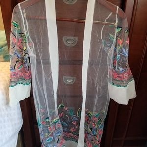 Beautiful embroidered cover up.